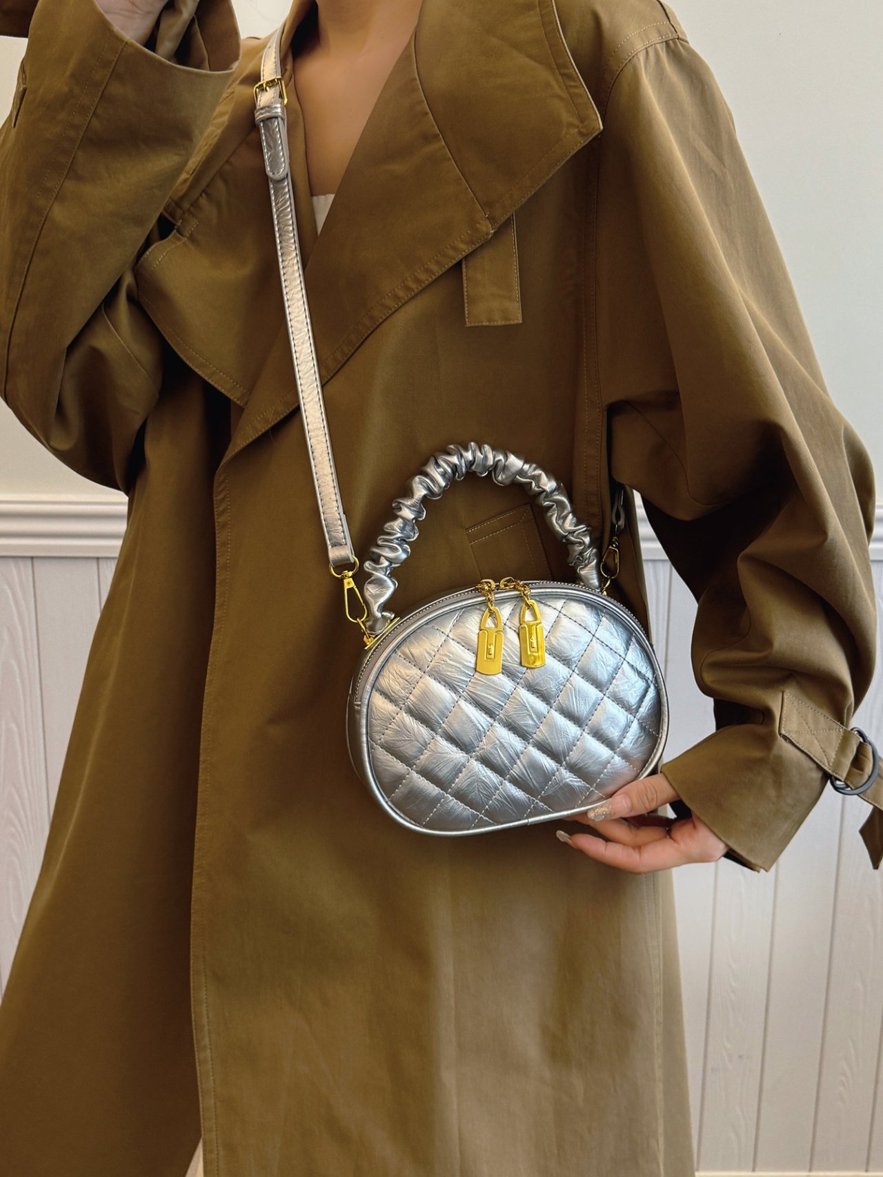 Silver Quilted Crossbody Bag with Gold Accents