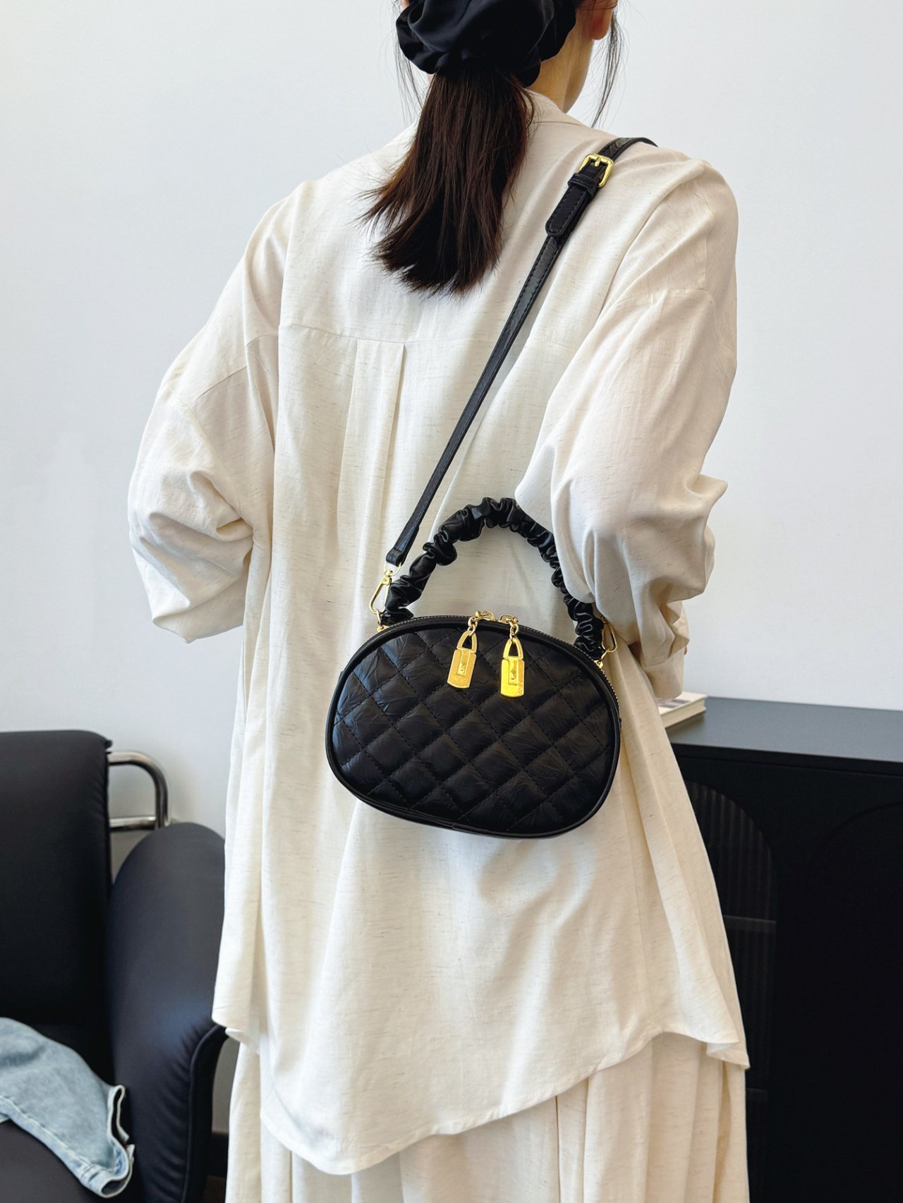 Black Quilted Crossbody Bag with Gold Accents