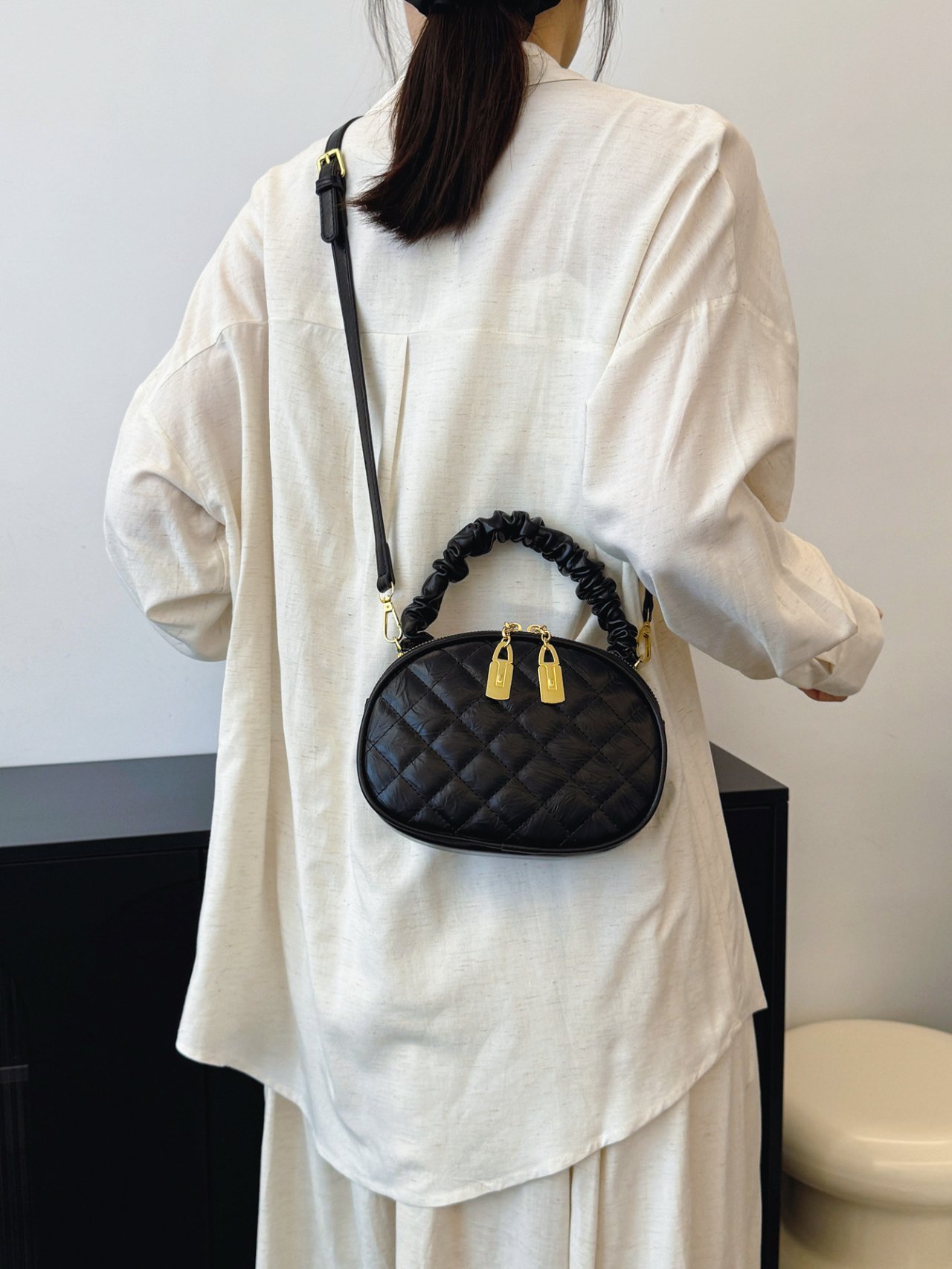 Black Quilted Crossbody Bag with Gold Accents