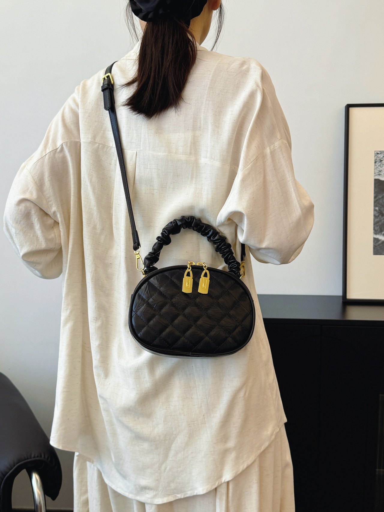 Black Quilted Crossbody Bag with Gold Accents
