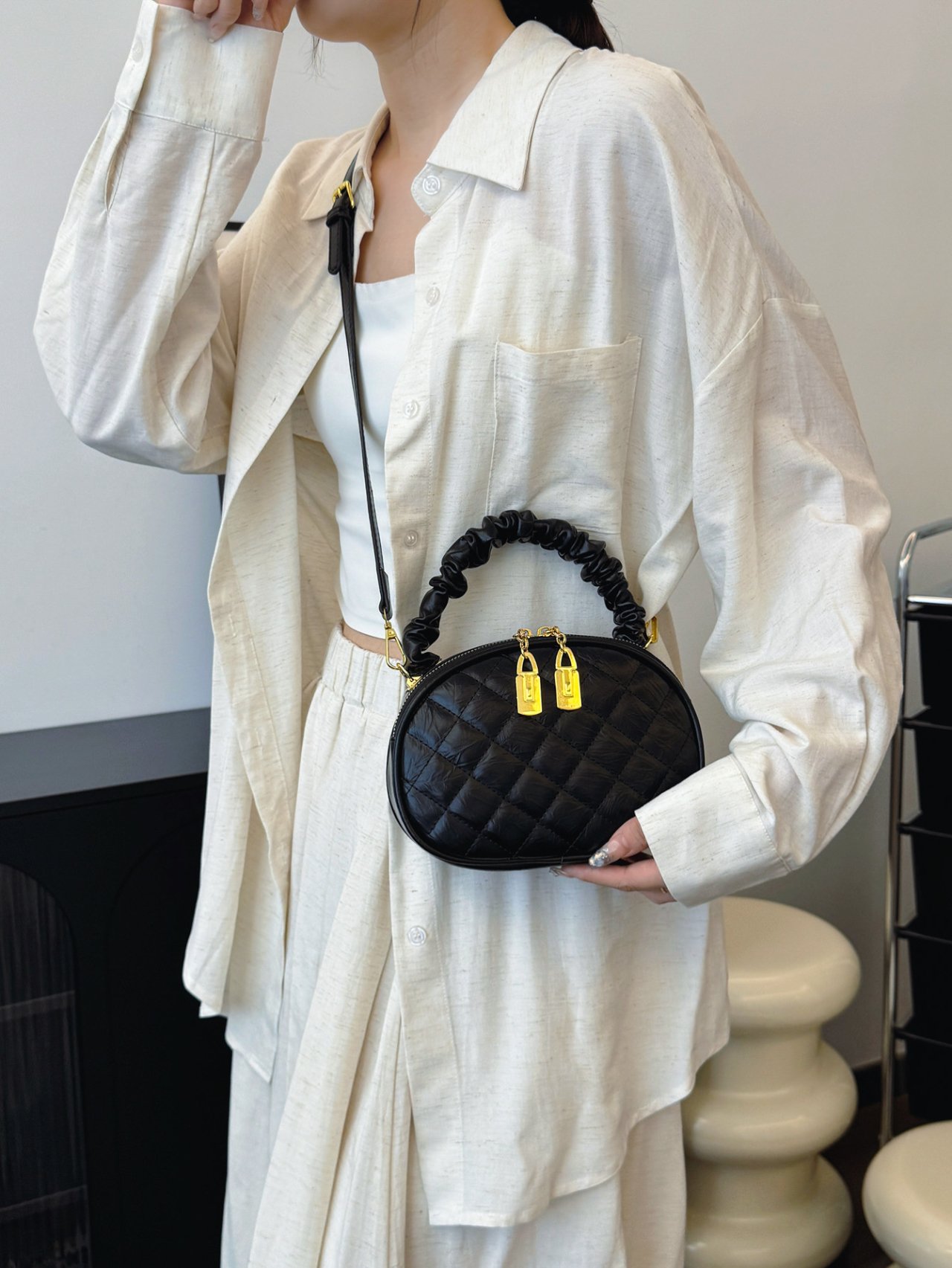 Black Quilted Crossbody Bag with Gold Accents