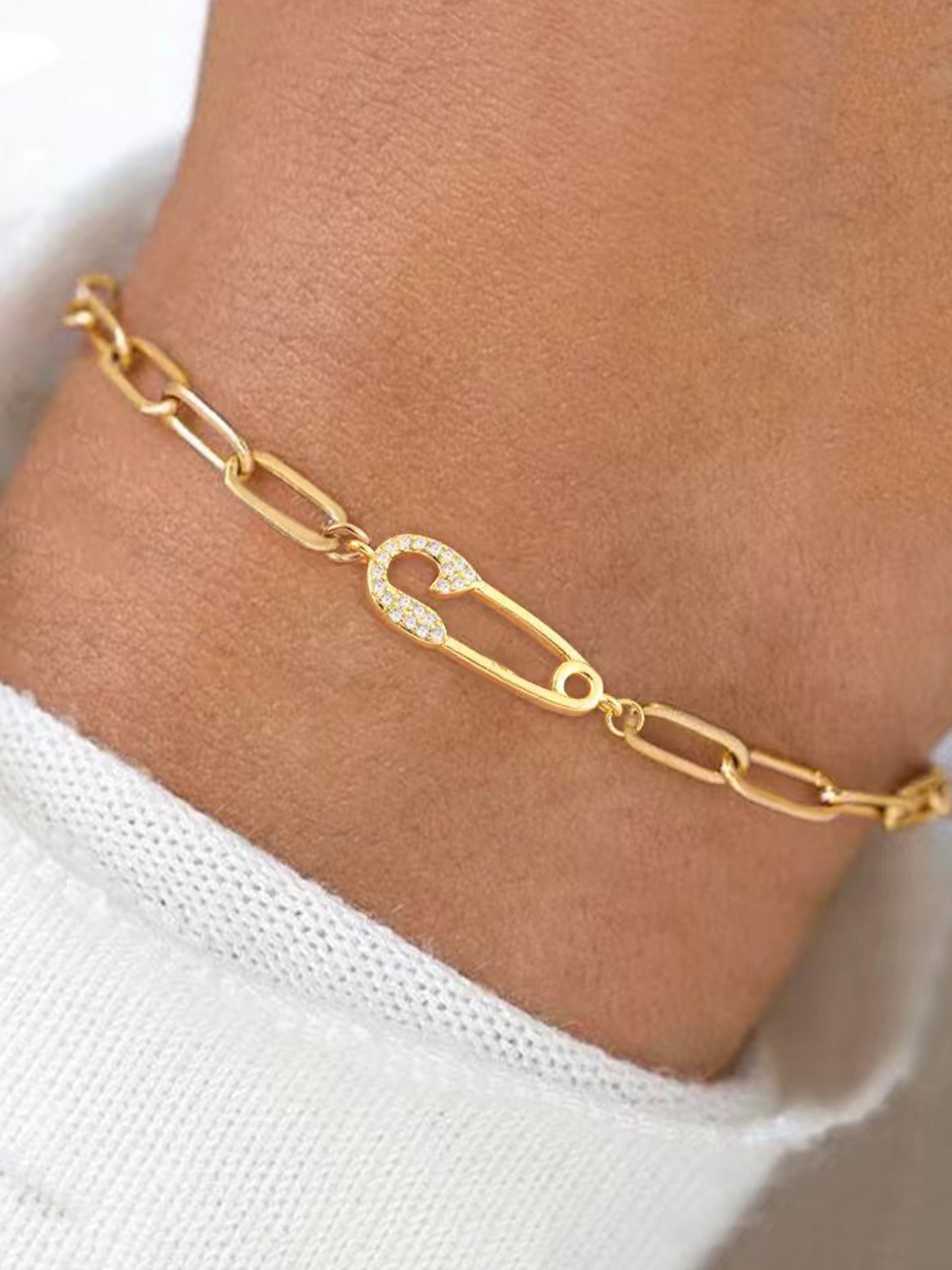 Gold Link Bracelet with Zirconia Safety Pin Charm