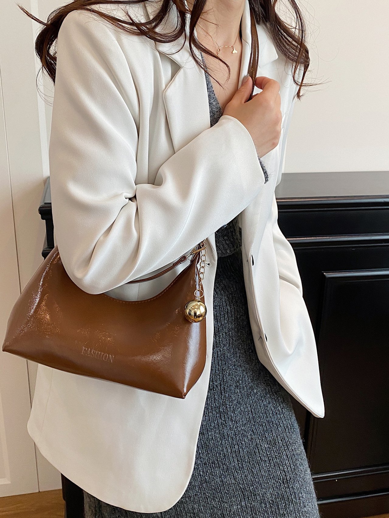 Brown Patent Croissant Crossbody Bag with Charm