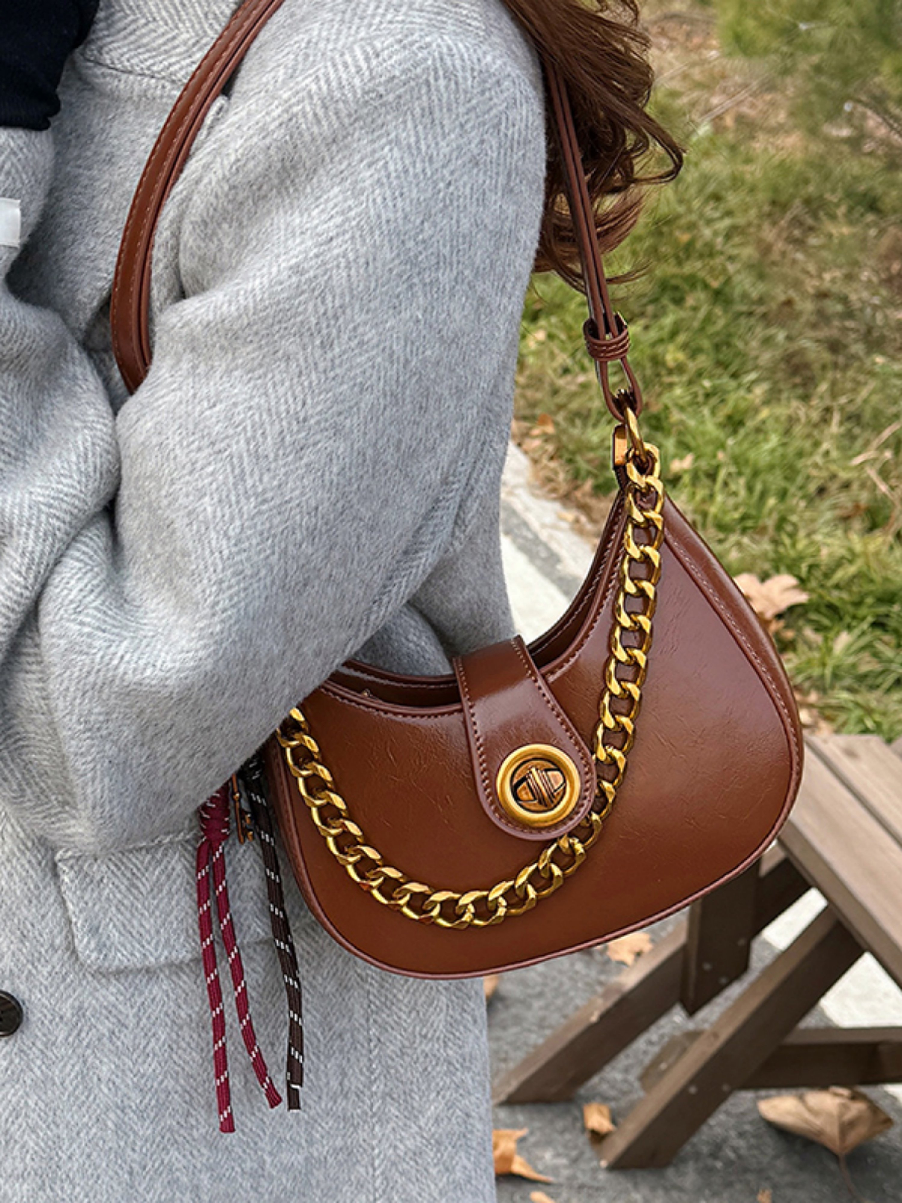 Brown Crescent Handbag with Gold Chain Detail