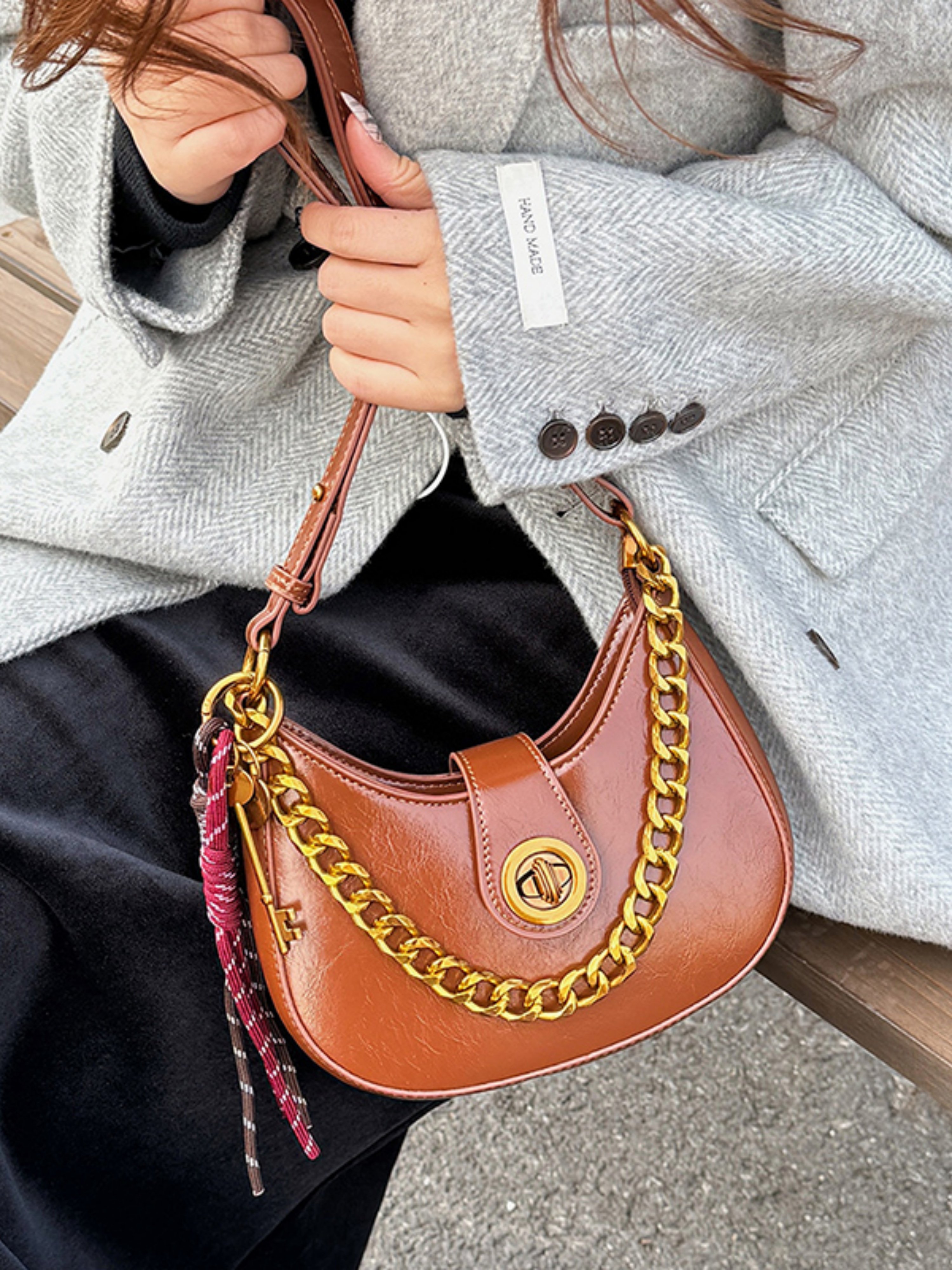 Brown Crescent Handbag with Gold Chain Detail