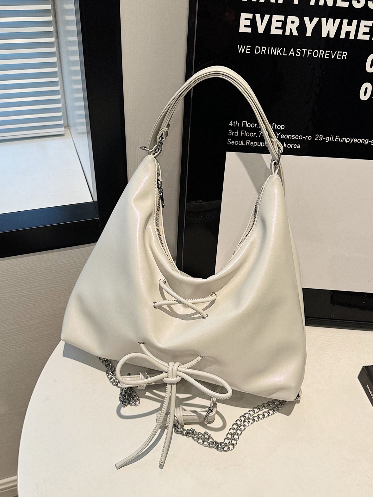 White Shoulder Bag with Drawstring and Chain Accent