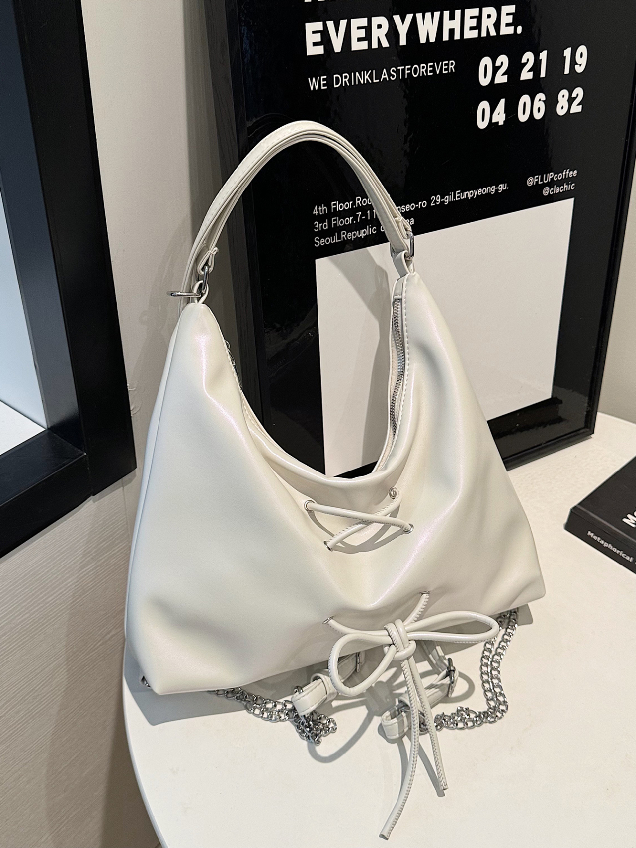 White Shoulder Bag with Drawstring and Chain Accent