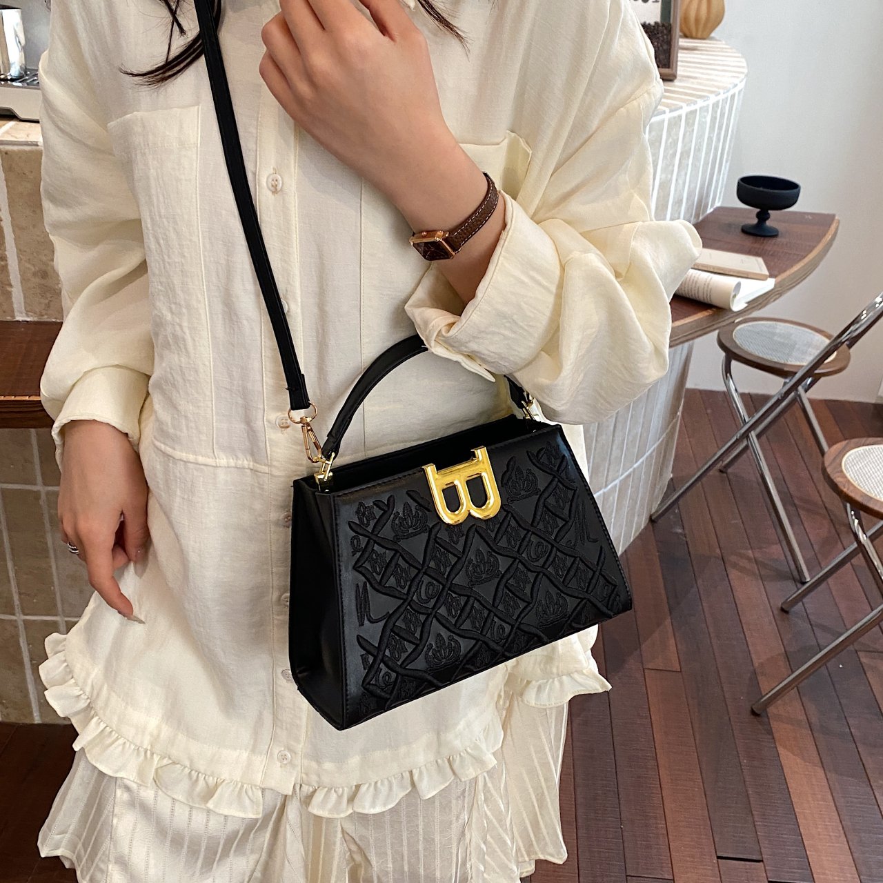 Black Crossbody Bag with Embossed Design
