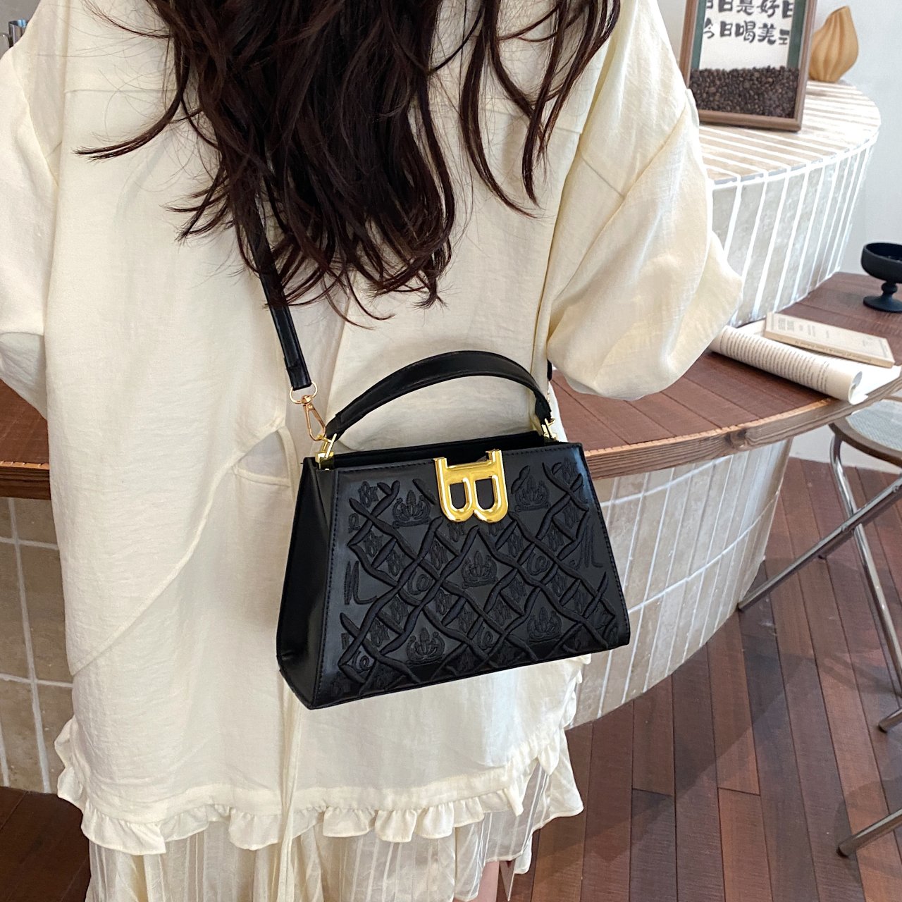 Black Crossbody Bag with Embossed Design
