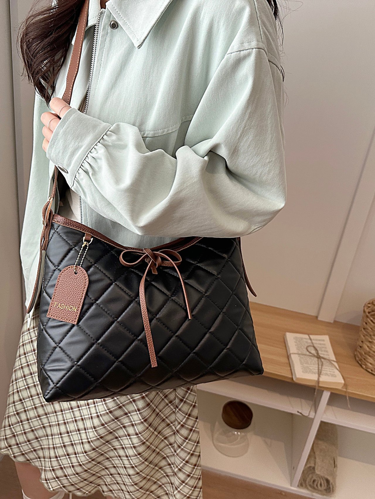 Black Quilted Crossbody Bag with Pendant