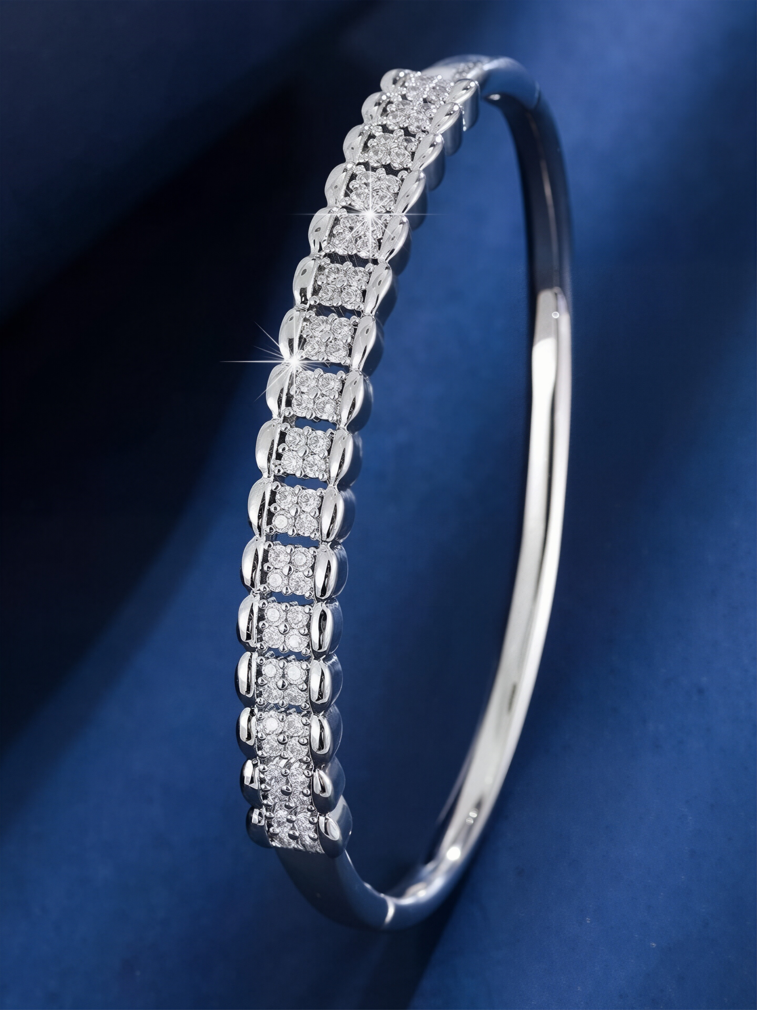 A silver honeycomb-shaped bracelet set with ultra-shiny cubic zirconia, perfect for parties and dinners