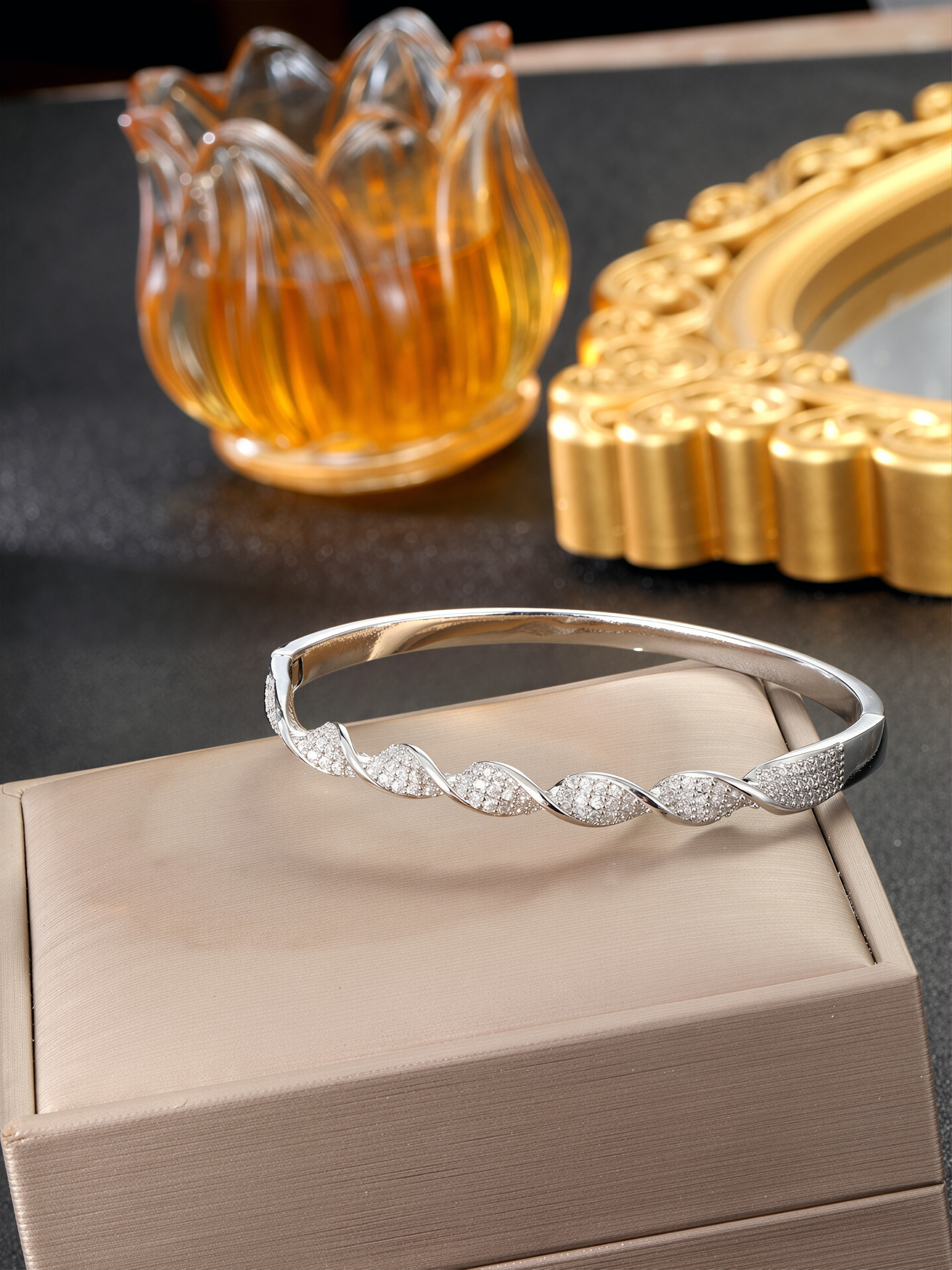A silver twisted design ladies bracelet set with ultra-shiny cubic zirconia, perfect for parties and dinners