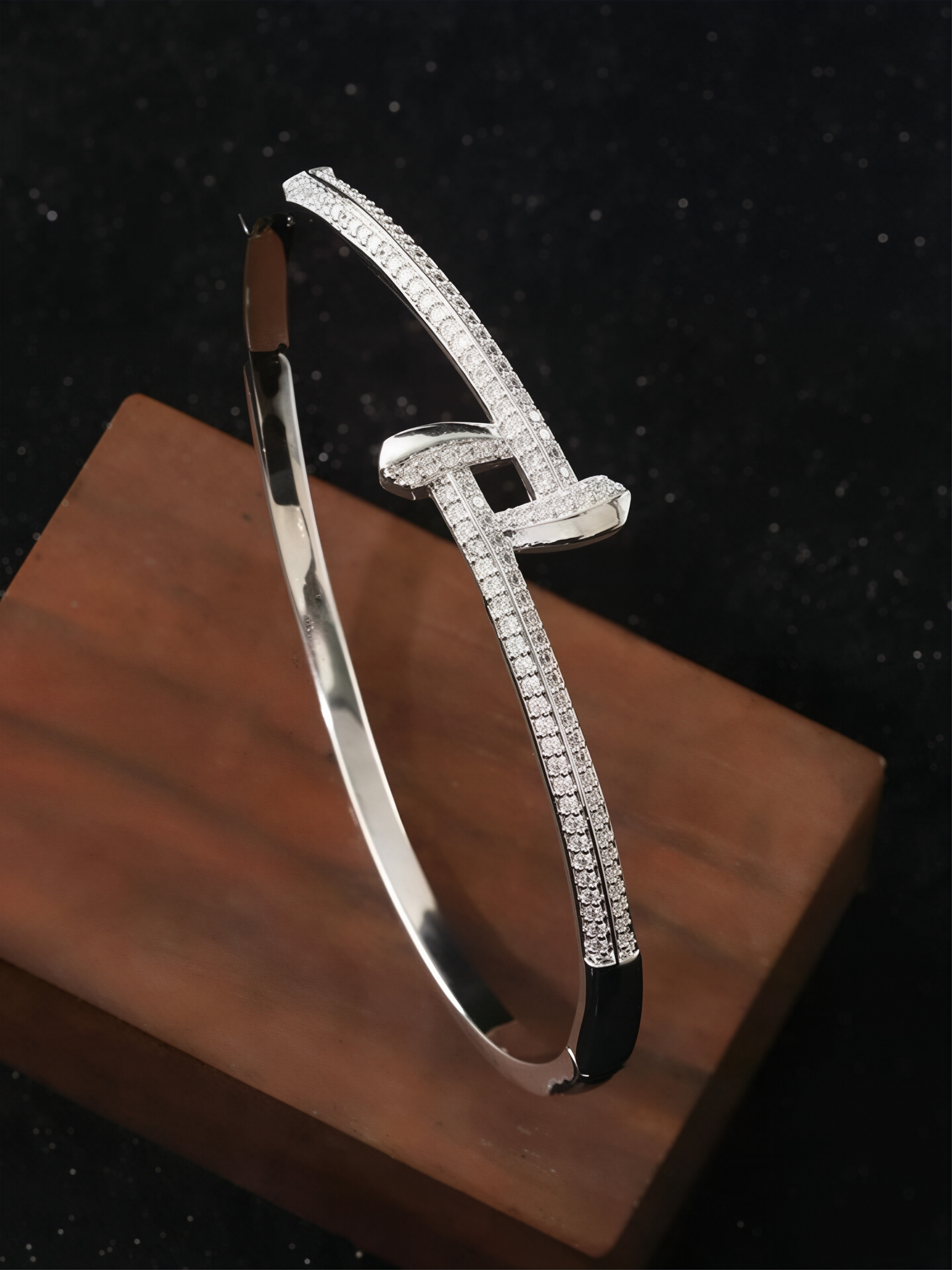 A silver stud-encrusted, ultra-shiny cubic zirconia womens bracelet, perfect for parties and dinners