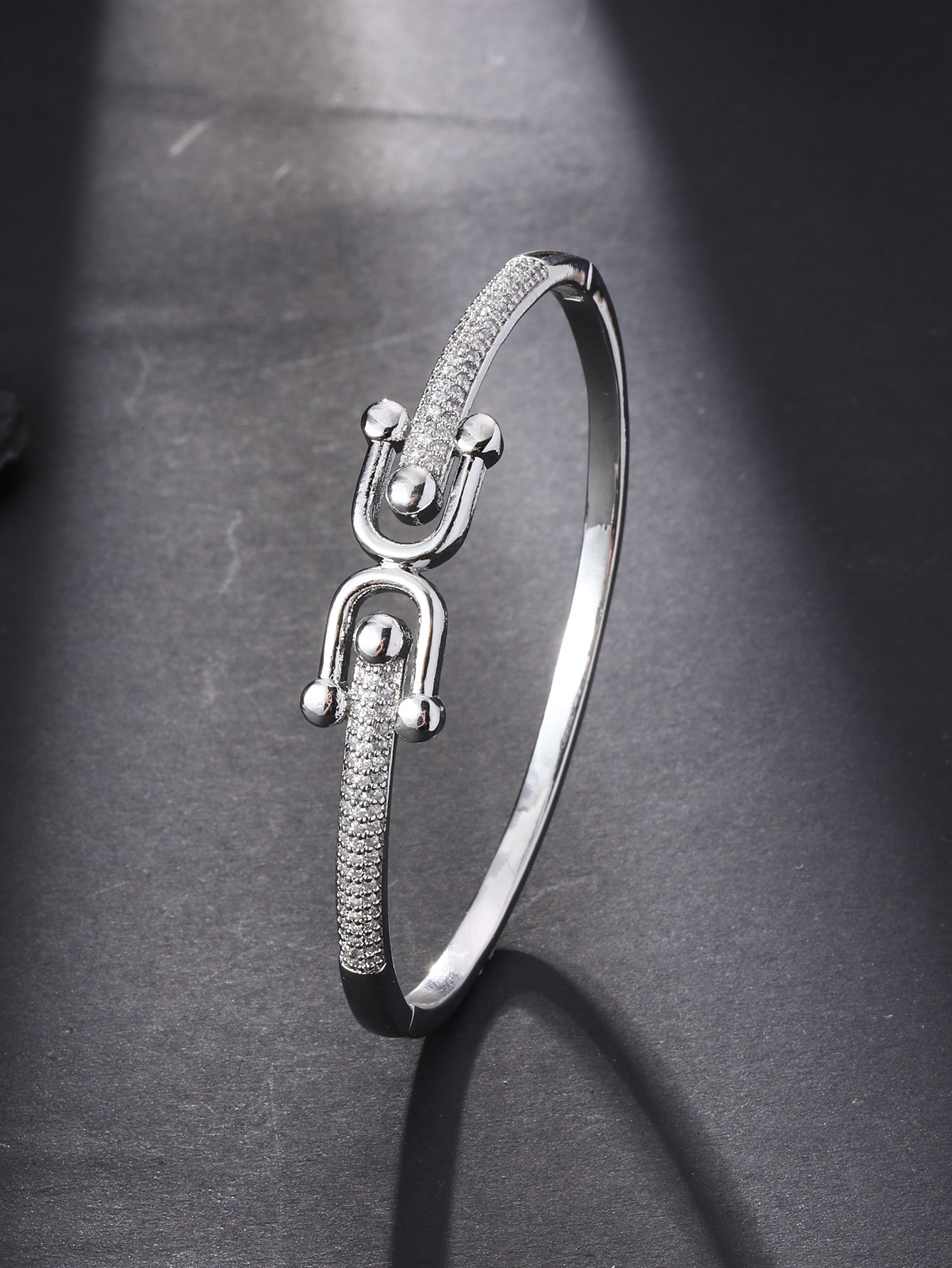 A silver-plated rust-proof bracelet in the shape of a horseshoe, made of cubic zirconia, suitable for ladies to wear to parties and events
