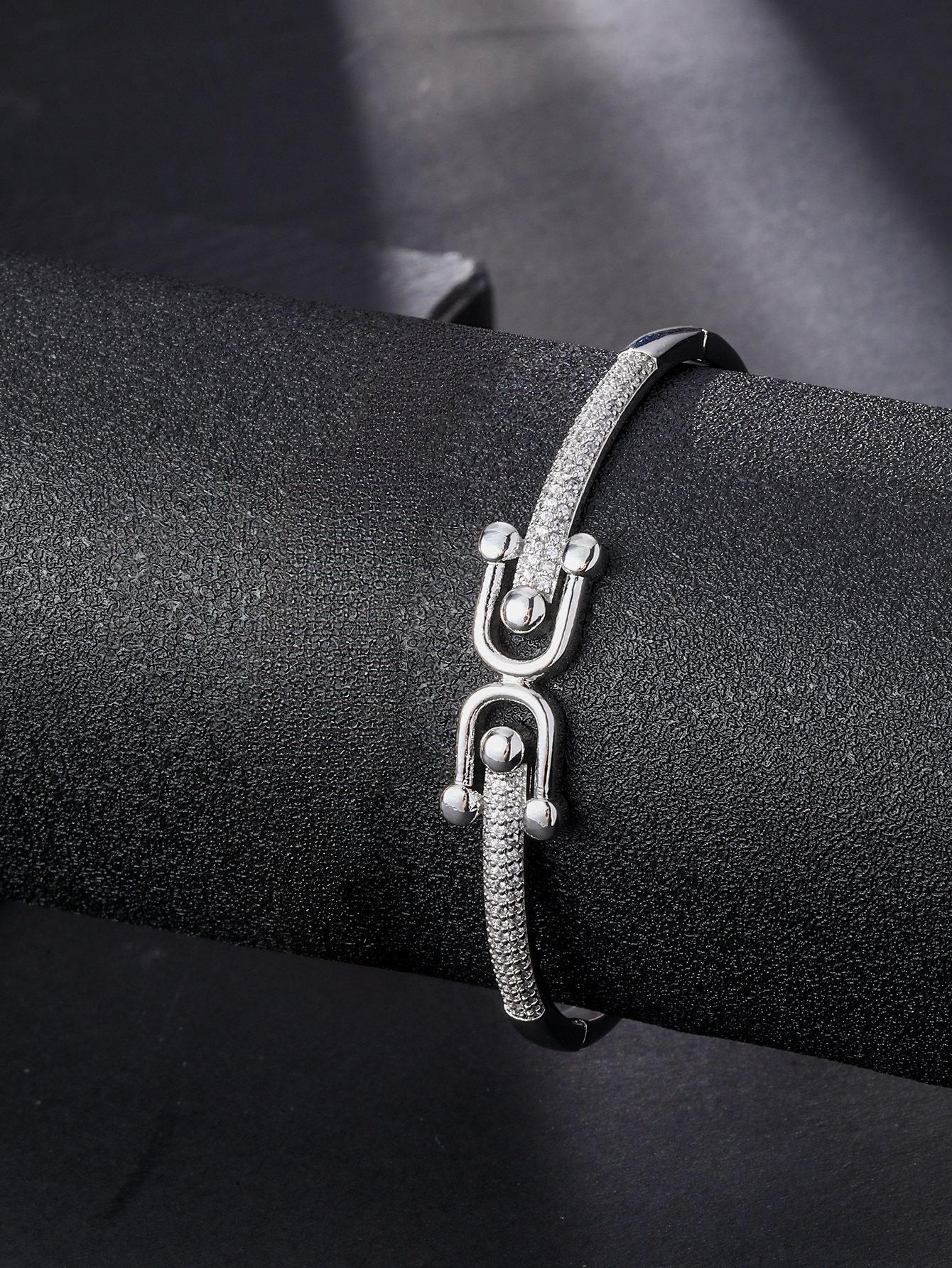 A silver-plated rust-proof bracelet in the shape of a horseshoe, made of cubic zirconia, suitable for ladies to wear to parties and events