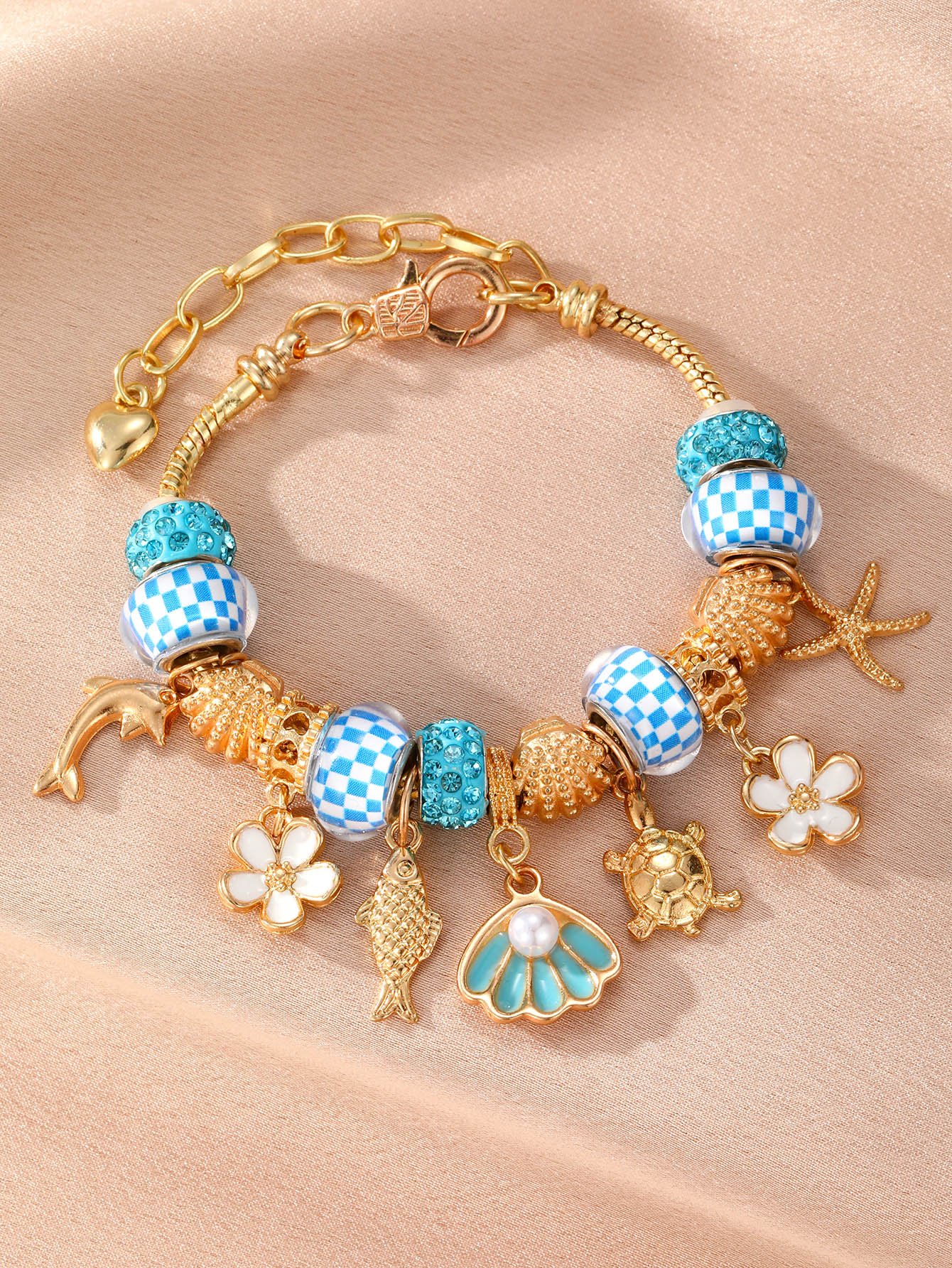 Gold-Plated Charm Bracelet with Nautical and Floral Accents
