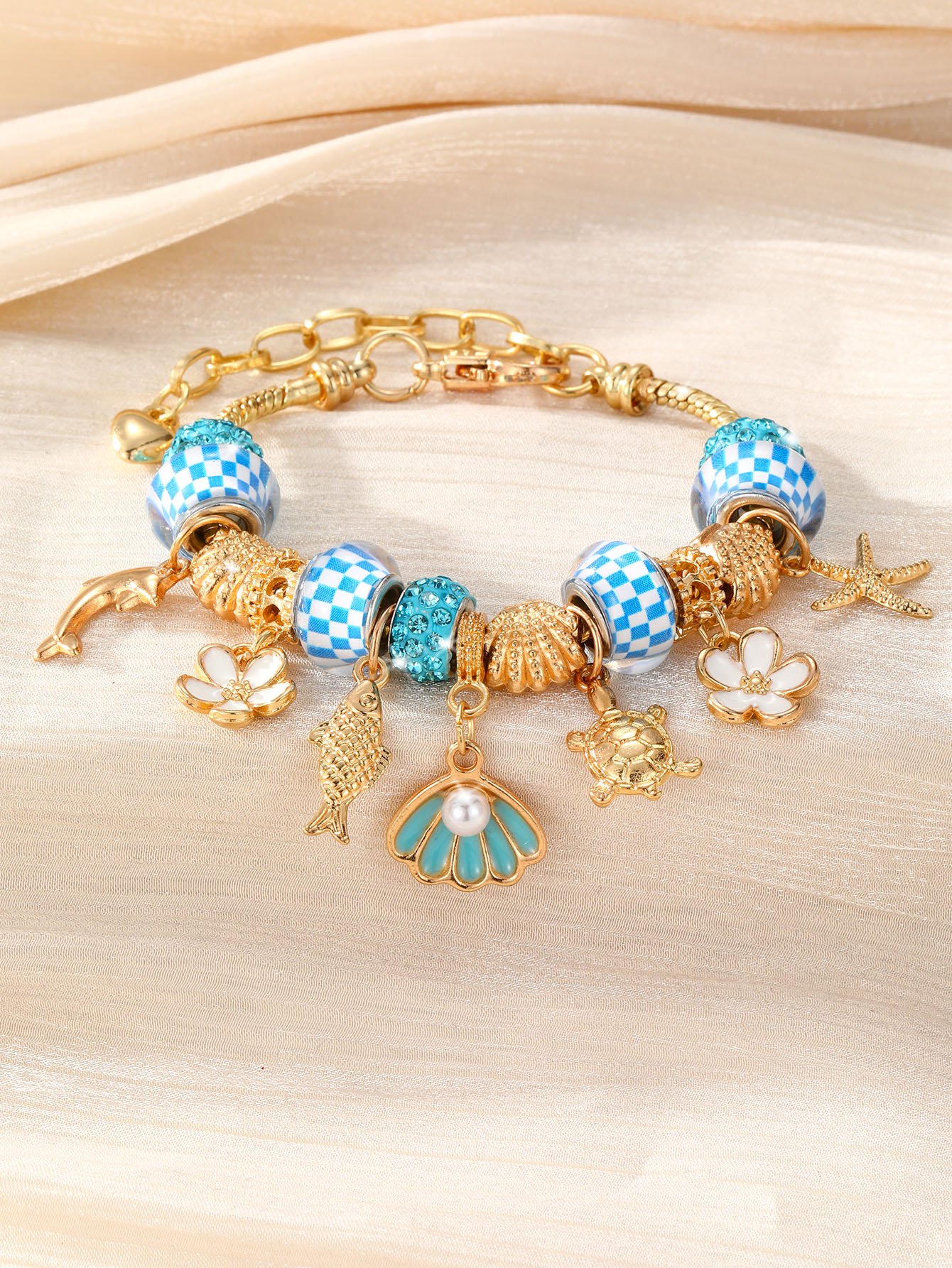 Gold-Plated Charm Bracelet with Nautical and Floral Accents