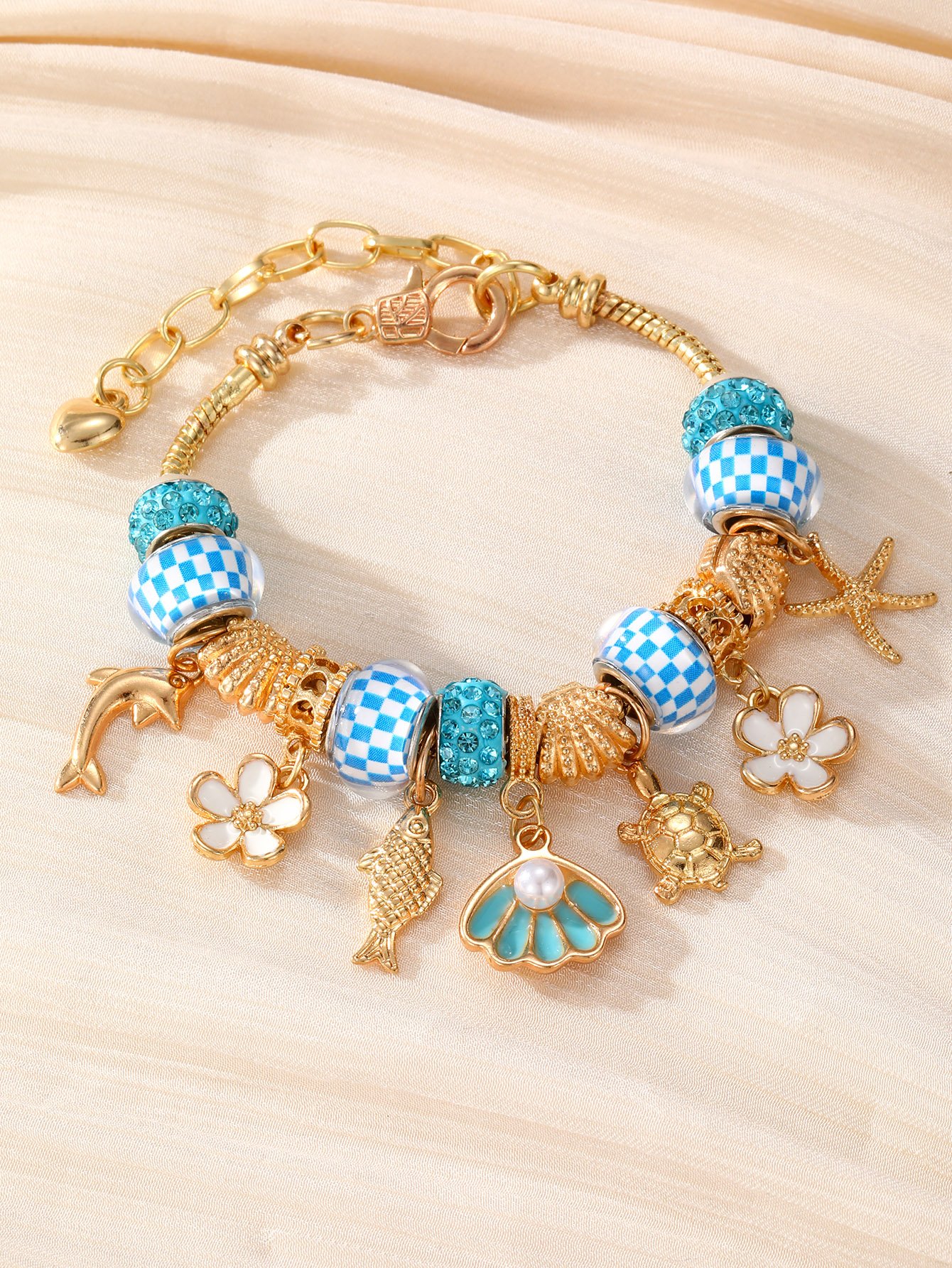 Gold-Plated Charm Bracelet with Nautical and Floral Accents
