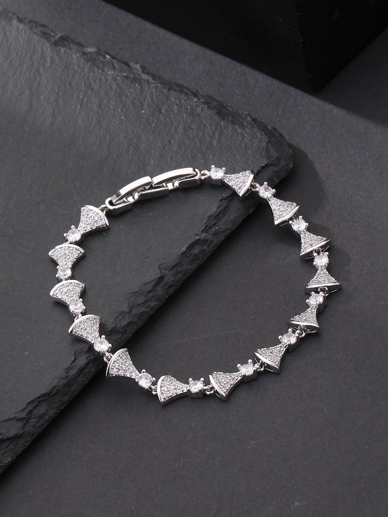 Silver fan-shaped bracelet set with ultra-shiny cubic zirconia, perfect for parties and dinners