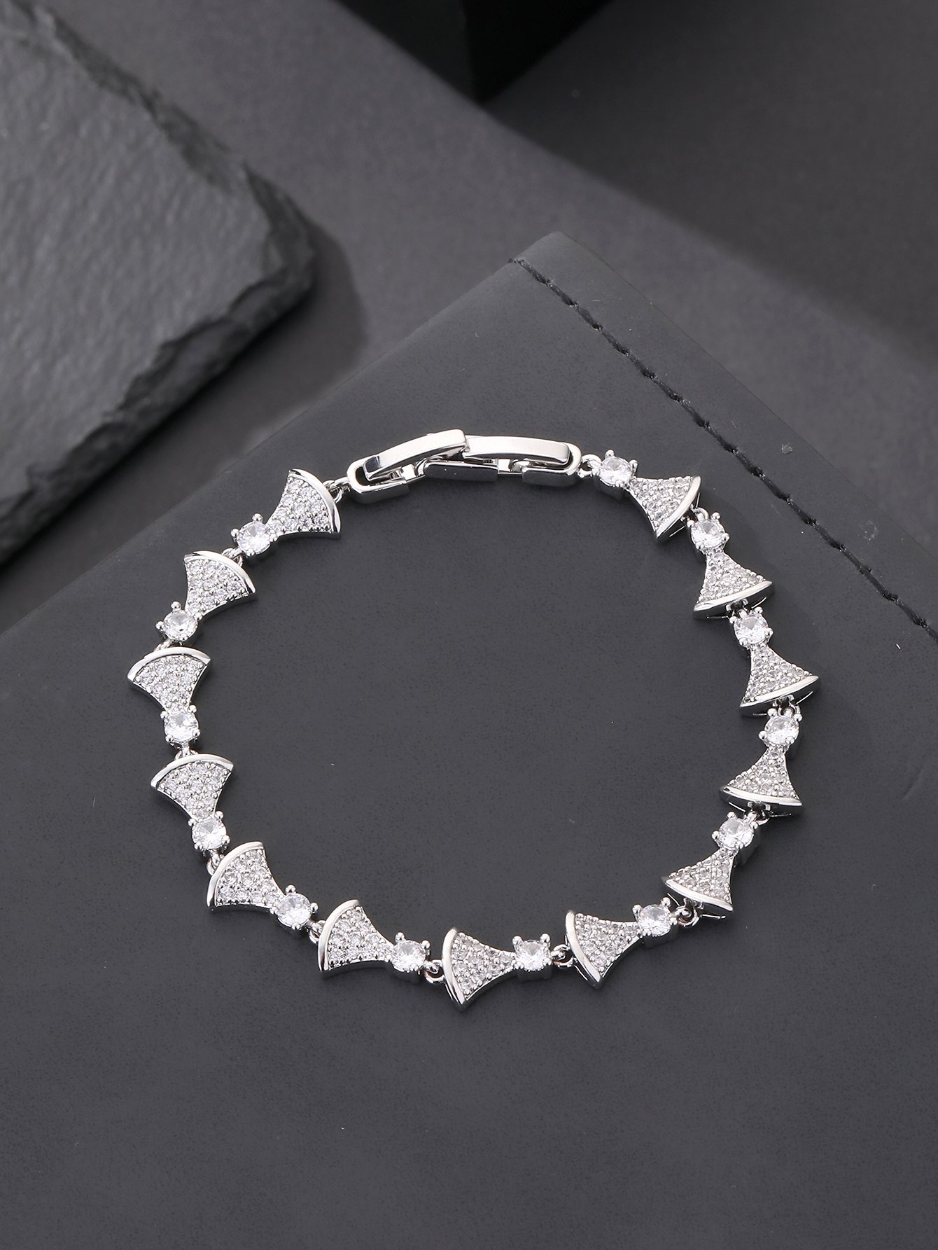 Silver fan-shaped bracelet set with ultra-shiny cubic zirconia, perfect for parties and dinners