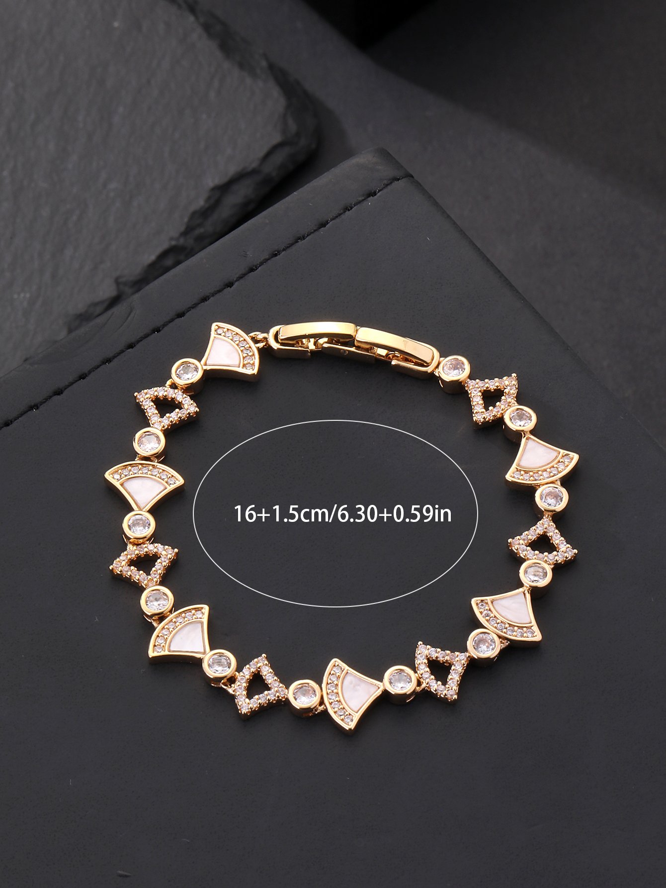Gold fan-shaped shell-encrusted ultra-shiny cubic zirconia womens bracelet, perfect for parties and dinners