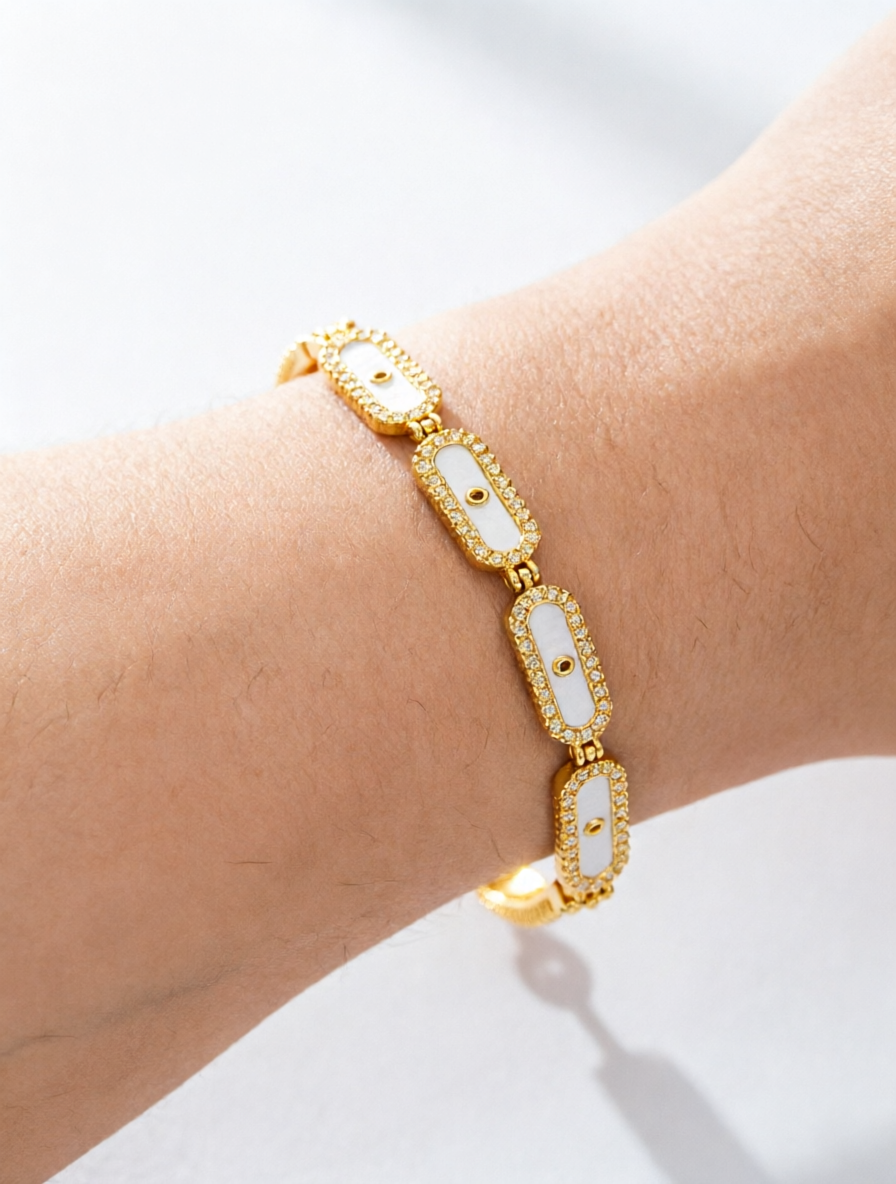 Golden oval shell bracelet set with ultra-shiny cubic zirconia, suitable for wearing to parties and dinners