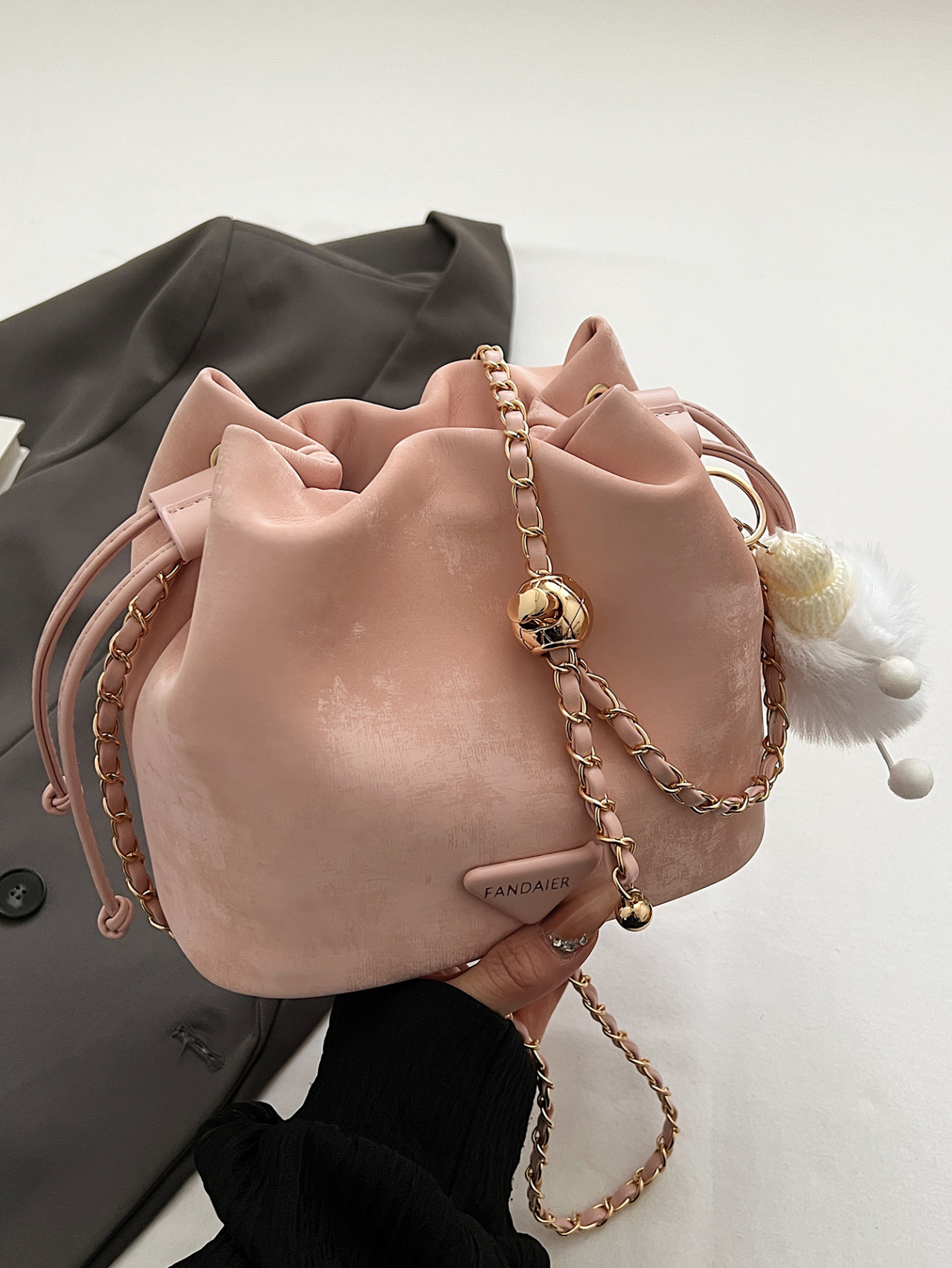 Pink Drawstring Crossbody Bag with Chain Strap