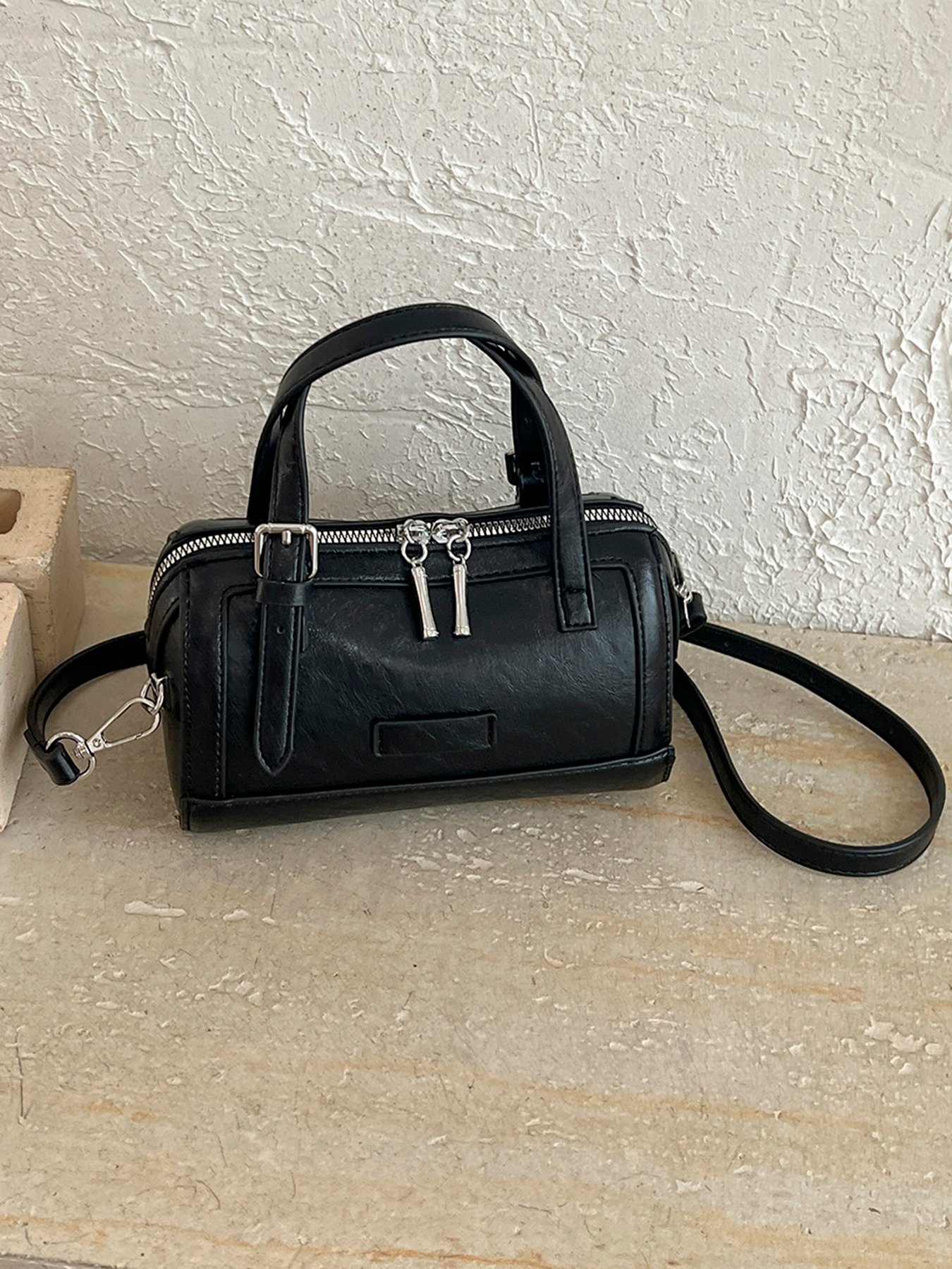 A womens handbag and crossbody bag