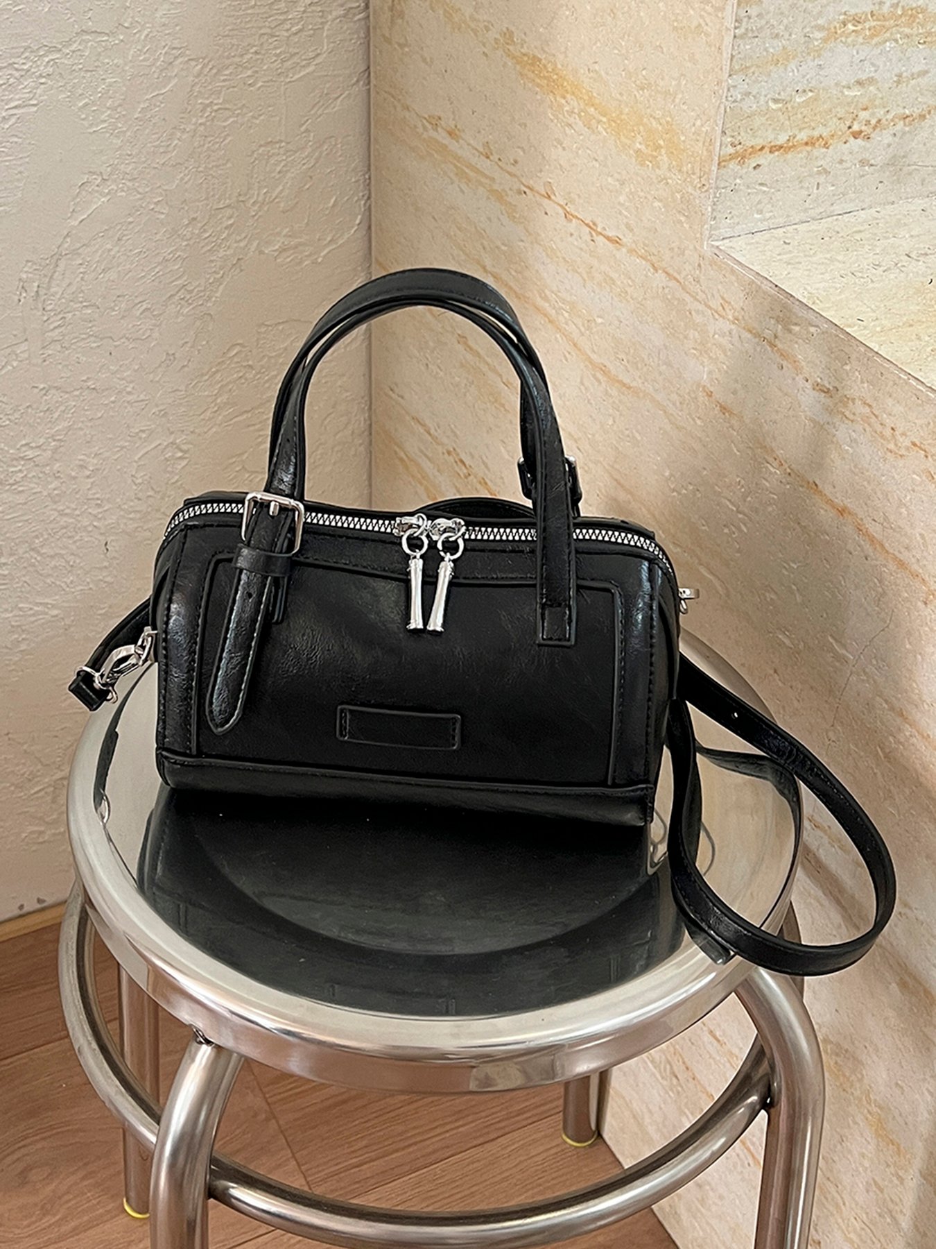 A womens handbag and crossbody bag