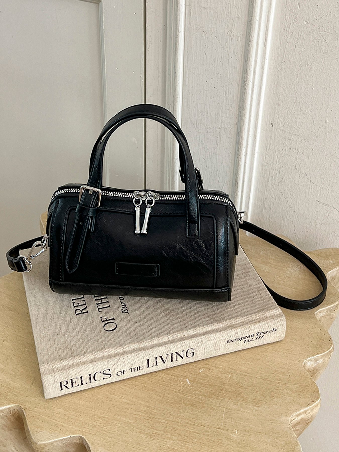 A womens handbag and crossbody bag