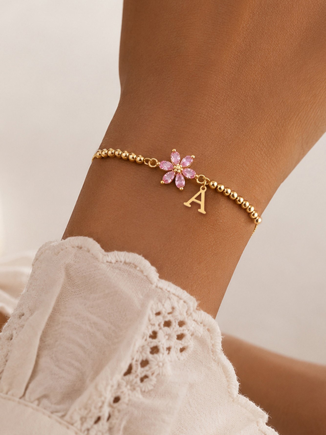 Golden Beaded Bracelet with Pink Flower and Initial Charm