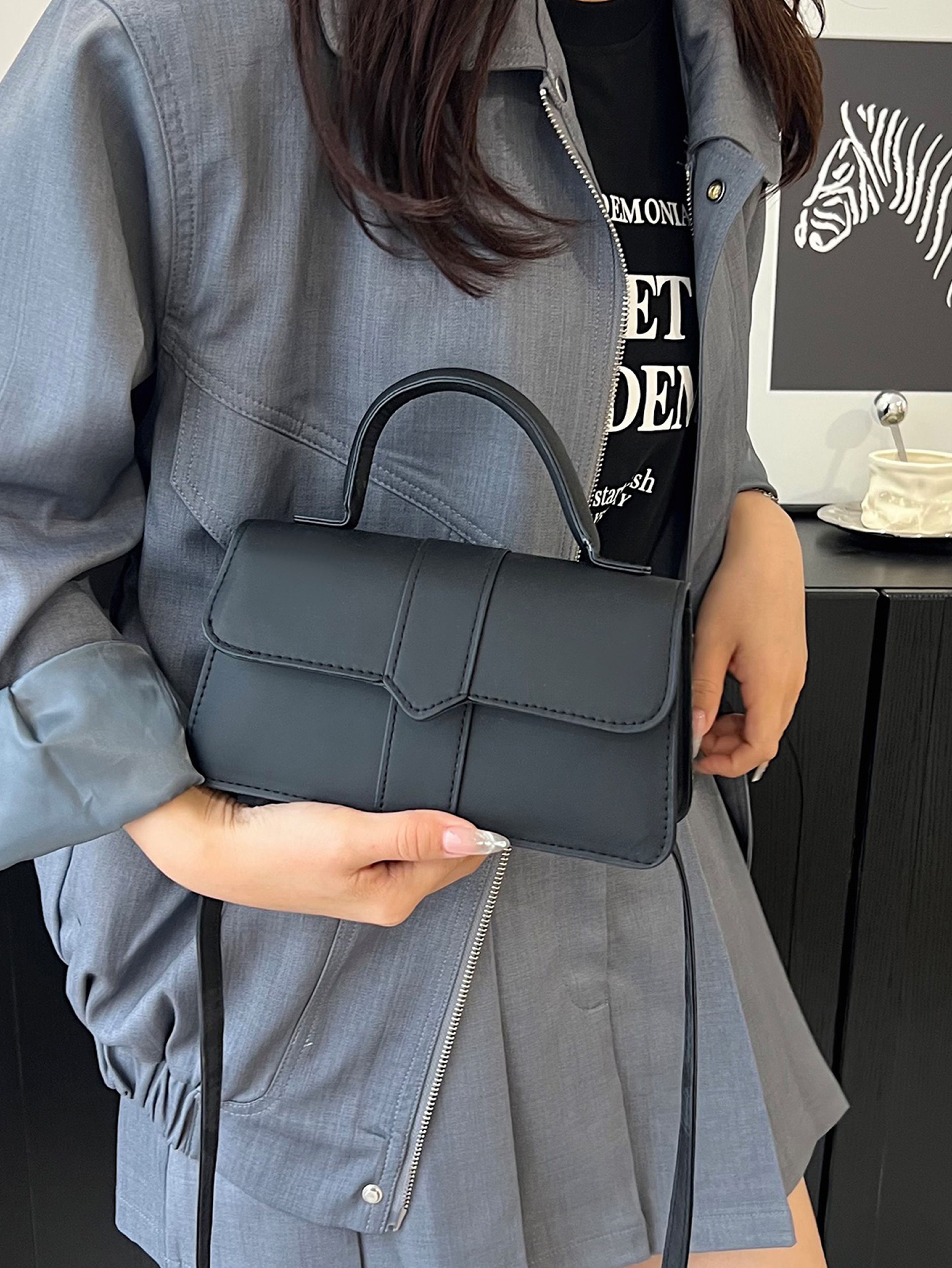 Black Handbag with Flap Closure