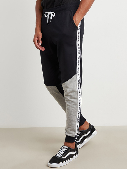Buy Slogan Print Side Tape Cut and Sew Jogger Black For Men Styli Saudi