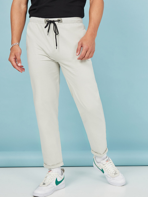 Buy Turn Up Hem Texture Woven Slim Fit Jogger Cream For Men Styli Saudi