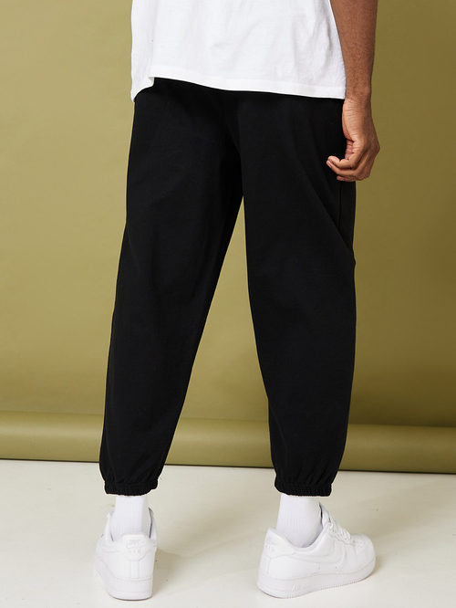 Buy Solid Oversized Fit Elastic Cuff Jogger Black For Men Styli Saudi