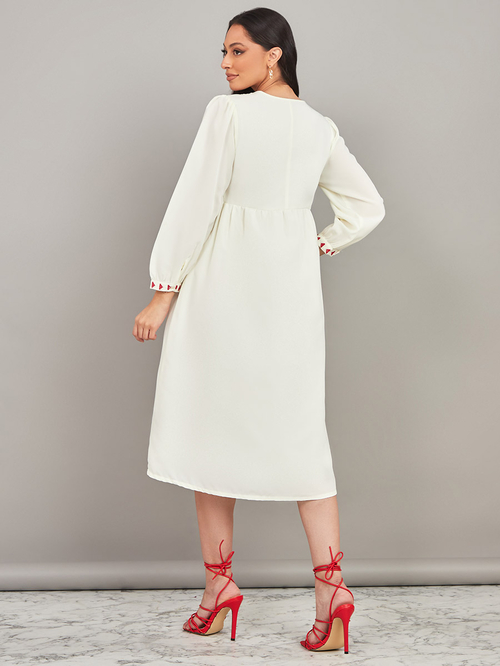 Buy Long Sleeves Embroidered A Line Midi Dress with Tassel Detail Cream For Women Styli Kuwait