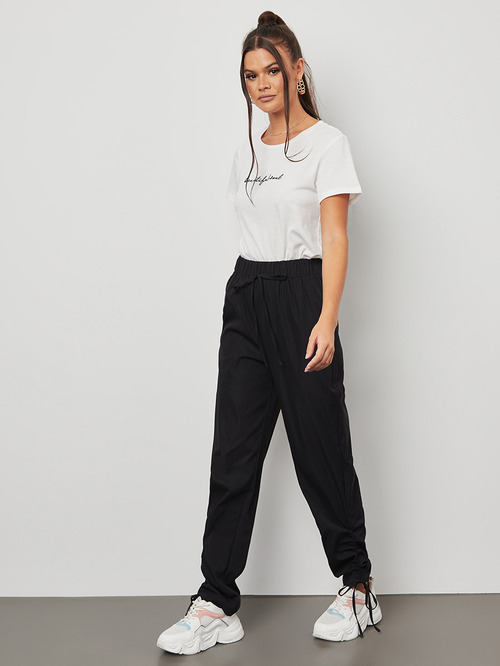 Buy Plain Jogger Pants Adjustable String On Cuff Black For Women Styli Saudi