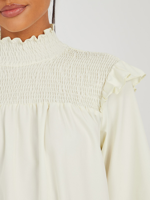 Buy Long Sleeves High Neck Smocked Detail Blouse with Shoulder Frill Cream  For Women | Styli Saudi