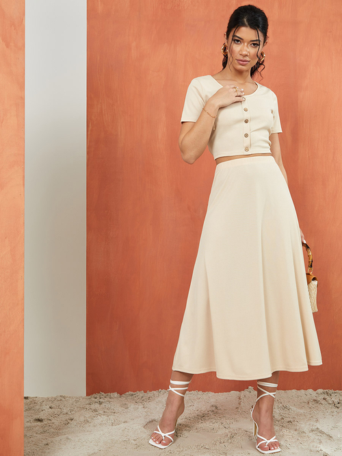 Buy Button Detail Knit Crop Top and A Line Maxi Skirt Co Ord Set Beige For Women Styli Saudi