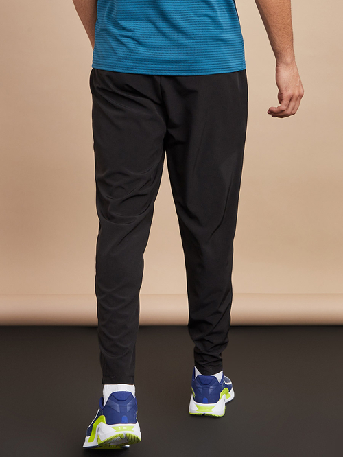 Buy Woven Running Track Pants with Zip Hem Black For Men Styli Saudi