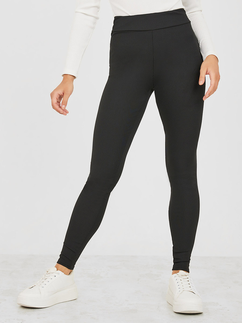 Solid High Rise Ribbed Knit Leggings | Styli