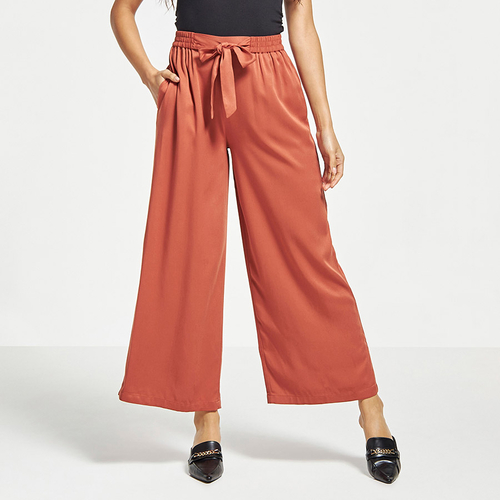 Buy Solid Wide Leg Palazzo Pants with Tie Ups Orange For Women