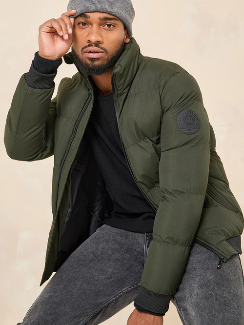 Buy High Neck Padded Puffer Jacket With Badge Detail Olive For Men Styli Kuwait