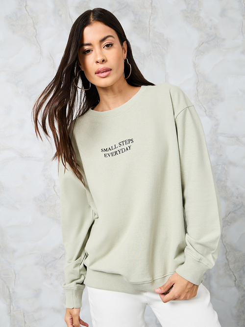 Buy Regular Fit Slogan Sweatshirt with Long Sleeve Green For Women Styli Saudi