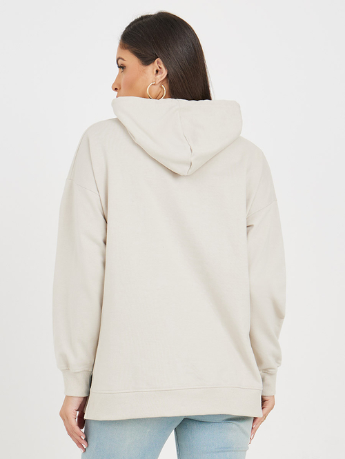 Buy Oversized Longline Hoodie with Badge Side Slit Beige For Women Styli UAE