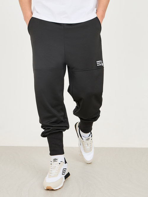 Buy Badge Detail Extra Wide Rib Cuff Low Rise Joggers Black For Men Styli Saudi