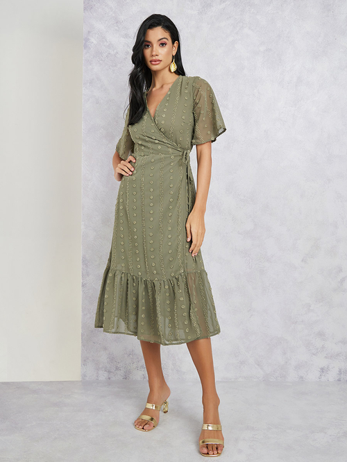 Buy Swiss Dot Ruffle Hem Wrap Midi Dress Green For Women Styli Saudi