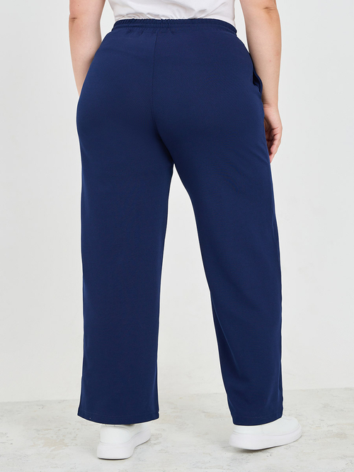 Buy Plus Solid Wide Leg Joggers with Pockets Navy Blue For Women Styli Saudi