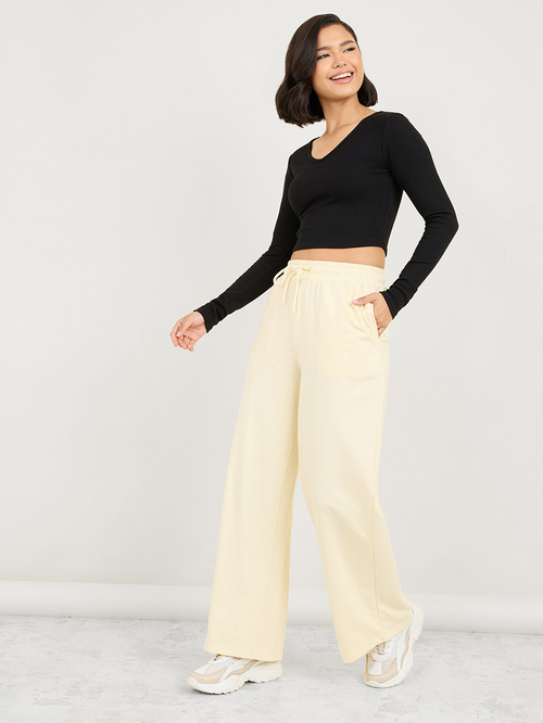 Buy Skater Fit Wide Leg Joggers Cream For Women Styli Saudi