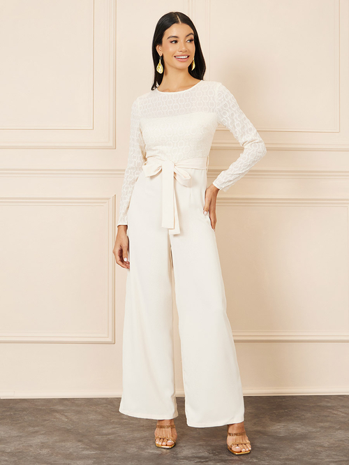 Buy Jacquard Texture Wide Leg Jumpsuit with Self Tie Up Cream For Women Styli Saudi
